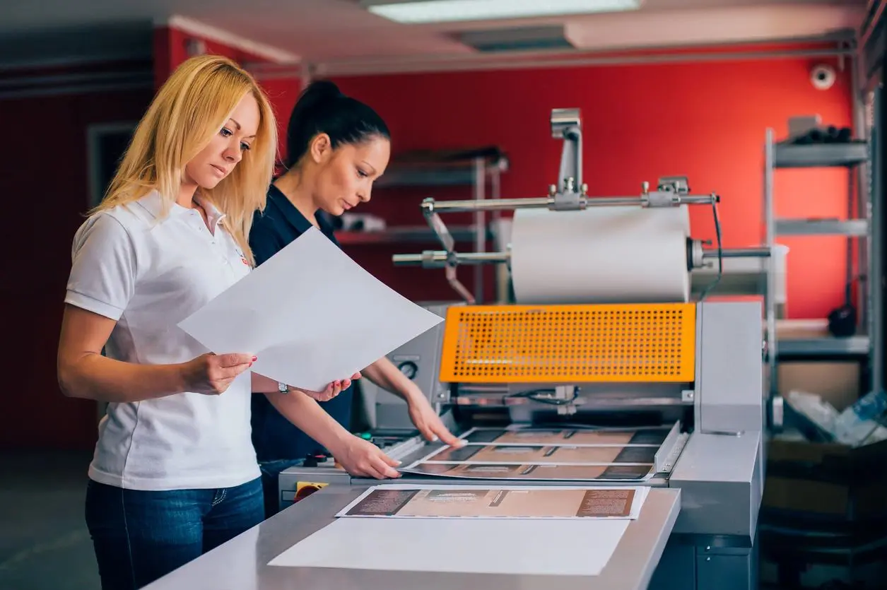 ladies with printing machine